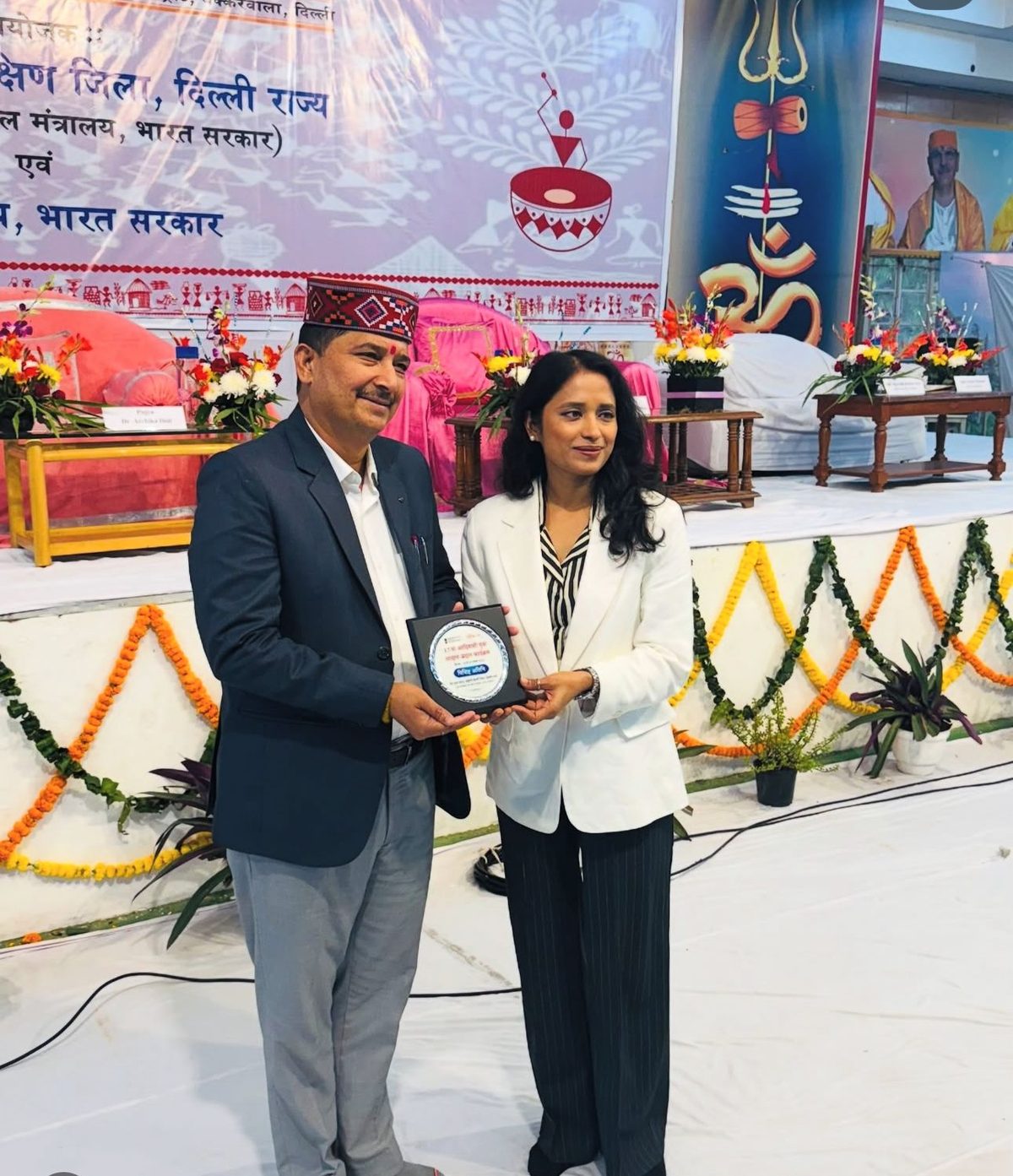 Pankhuri Srivastava receiving recognition for her contribution to wellness